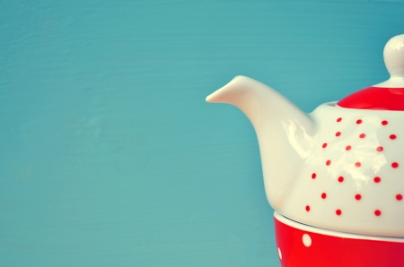 red tea kettle on blue backgroundの写真素材