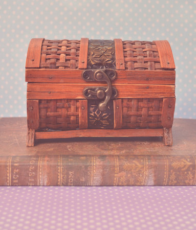 Decorative vintage chest box on old bookの写真素材