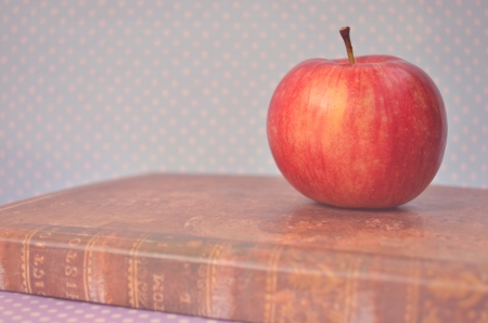 Apple on old book vintageの写真素材
