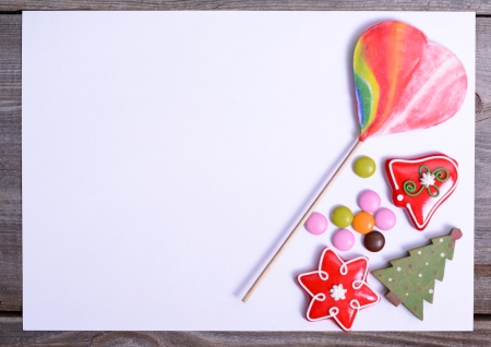 Blank paper with candy and Christmas decorationの写真素材