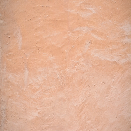 Retro yellow concrete wall backgroundの写真素材