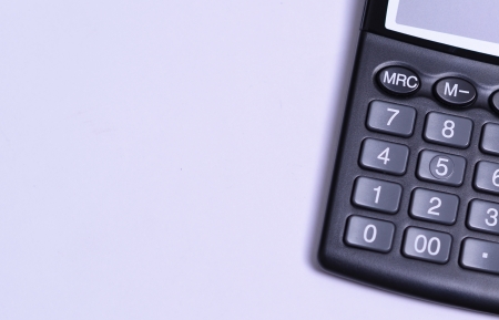 Close up of calculator on blank paperの写真素材