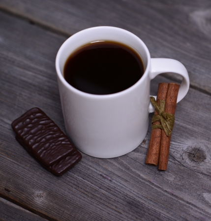 Mug of coffeek with cinnamon and chocolateの写真素材