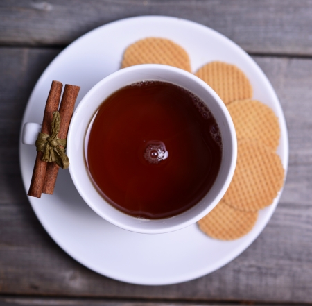Cookies and cup of tea on wooden backgroundの写真素材