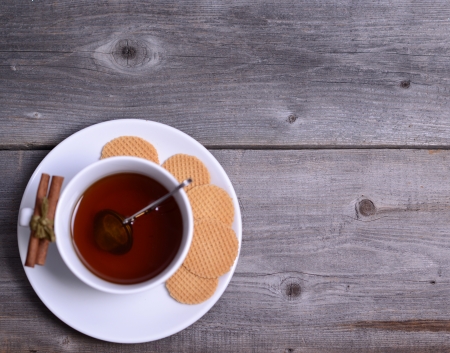 Cookies and cup of tea on wooden の写真素材
