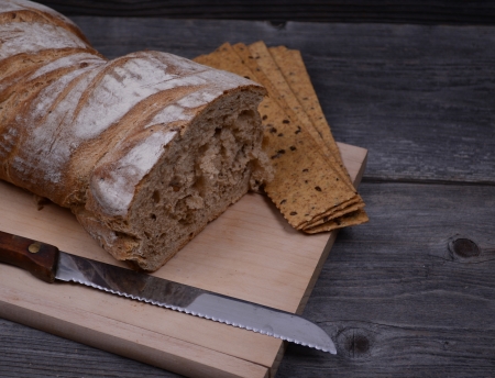 fresh bread and flax chips on the woodenの写真素材
