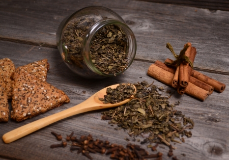 Green Tea, cookies and cinnamon close upの写真素材
