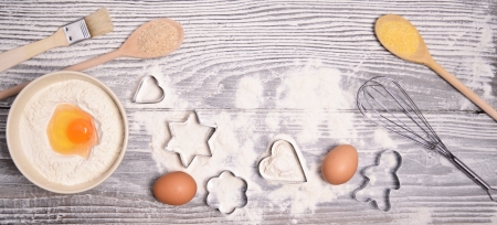ingredients and molds for baking cookies on wooden backgroundの写真素材