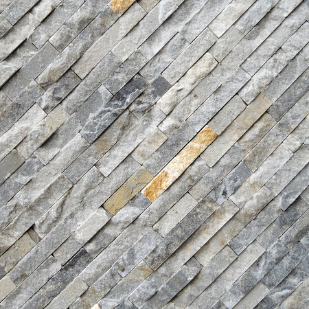 Black diagonal stone wall backgroundの写真素材