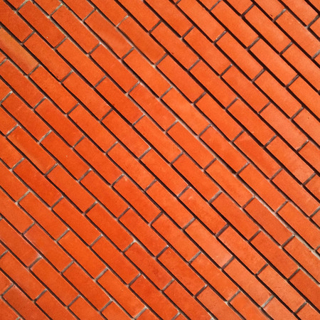 Red diagonal brick wallの写真素材