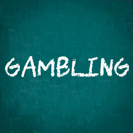 GAMBLING written on chalkboardの写真素材