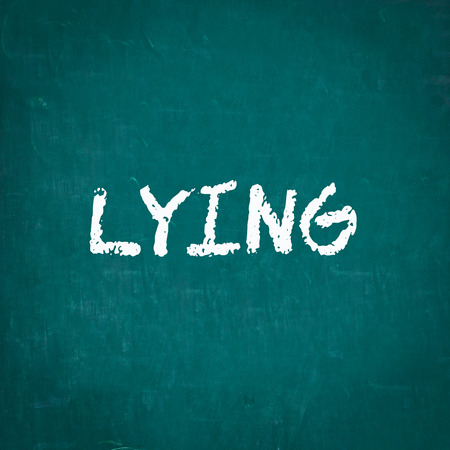 LYING written on chalkboardの写真素材