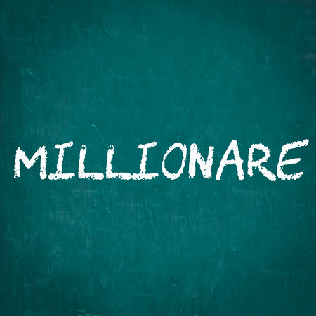MILLIONARE written on chalkboardの写真素材