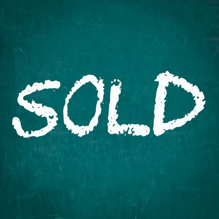 SOLD written on chalkboardの写真素材