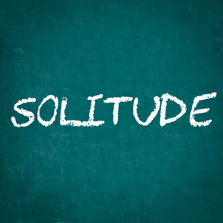 SOLITUDE written on chalkboardの写真素材