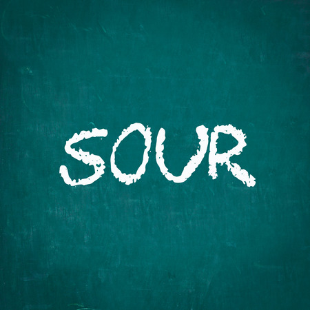 SOUR written on chalkboardの写真素材