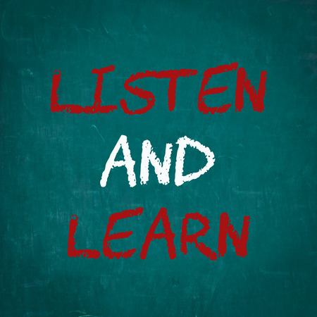 LISTEN AND LEARN written on chalkboardの写真素材