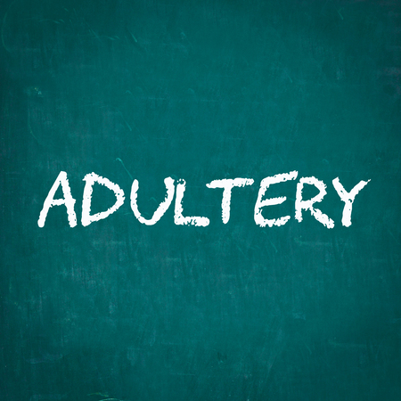 ADULTERY written on chalkboardの写真素材