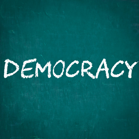 DEMOCRACY written on chalkboardの写真素材