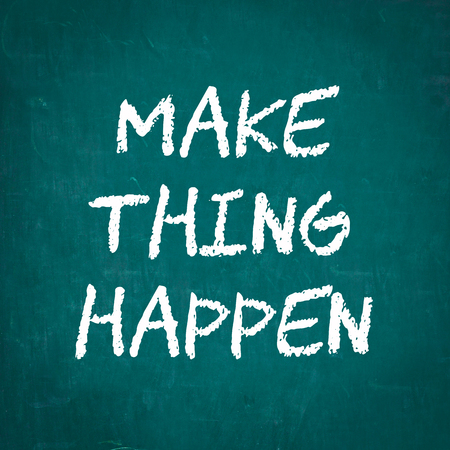 MAKE THING HAPPEN written on chalkboardの写真素材