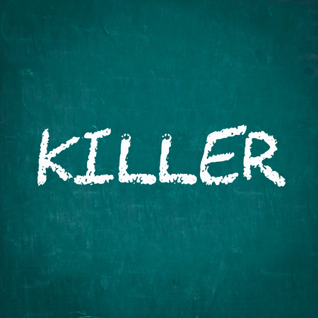 KILLER written on chalkboardの写真素材