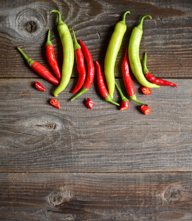 Chilly pepper ( yellow and red ) on the wooden backgroundの写真素材
