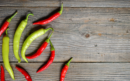 Chilly pepper on the wooden backgroundの写真素材