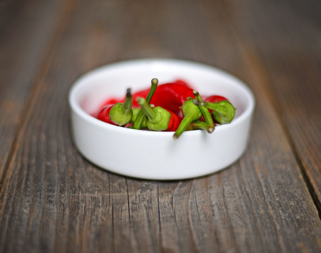 Chilly pepper on the wooden backgroundの写真素材