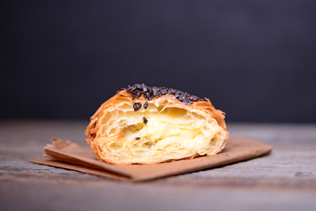 Chocolate croissant on wooden backgroundの写真素材