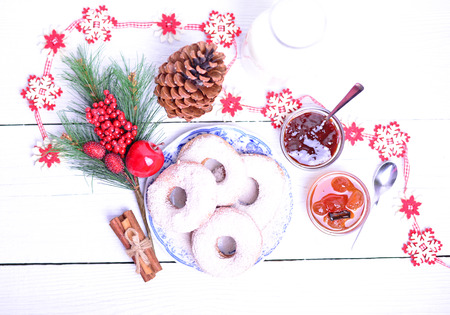 Christmas donuts on white wooden tableの写真素材