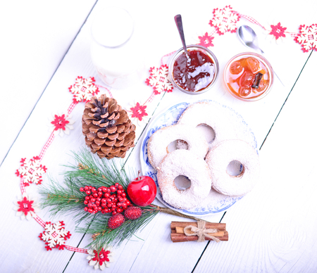 Christmas donuts on white wooden tableの写真素材