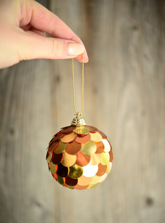 Christmas ornament in woman handの写真素材
