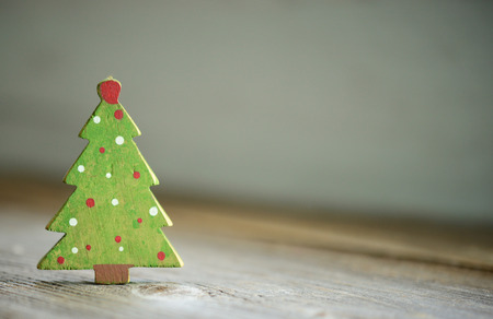 Christmas green tree ornament on wood backgroundの写真素材