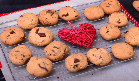 Chocolate cookies with red strip and decorative heartの写真素材