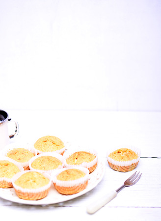 Cornbread muffins on white wooden tableの写真素材
