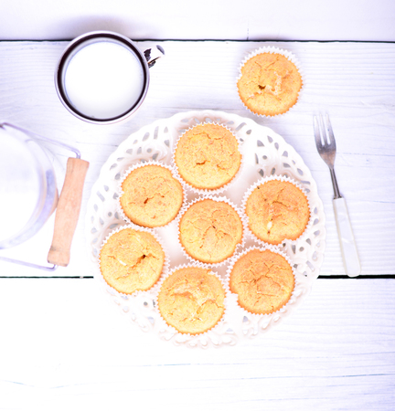 Cornbread muffins on white wooden tableの写真素材