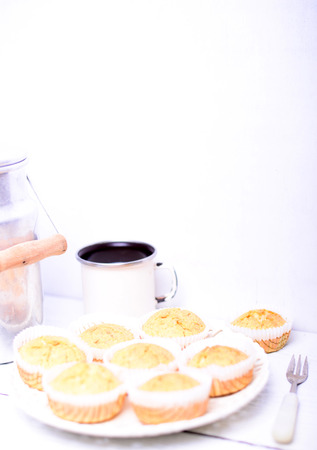 Cornbread muffins on white wooden tableの写真素材