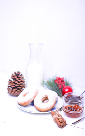 Donuts for Christmas breakfast on white wooden tableの写真素材