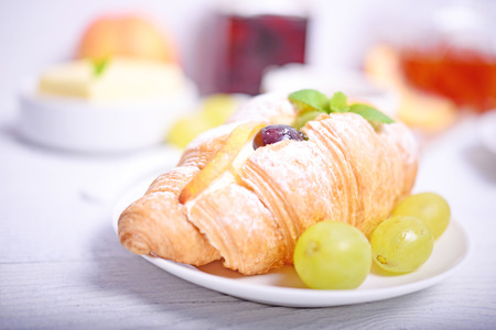 Fresh fruit croissant on white backgroundの写真素材