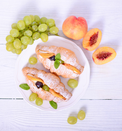 Fresh fruit croissant on white backgroundの写真素材