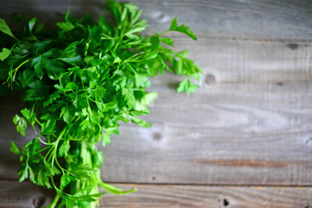 fresh parsley on wooden backgroundの写真素材