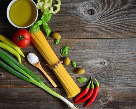 Ingredients for spaghetti bolognese on wooden backgroundの写真素材