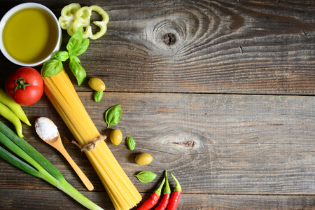 Ingredients for spaghetti bolognese on wooden backgroundの写真素材