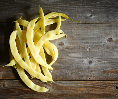 Yellow beans on old tableの写真素材