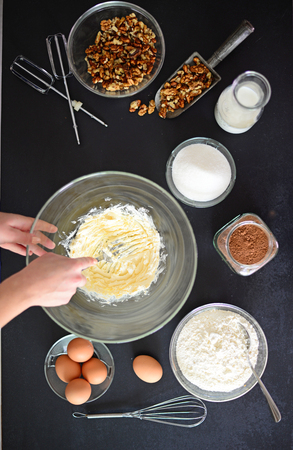 Woman preparing butter for cake on blackboardの写真素材