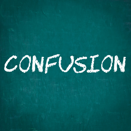 CONFUSION written on chalkboardの写真素材