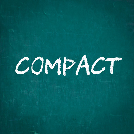 COMPACT written on chalkboardの写真素材