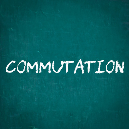 COMMUTATION written on chalkboardの写真素材