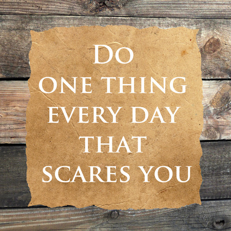 Inspirational quoteon  grunge paper against wood backgroundの写真素材