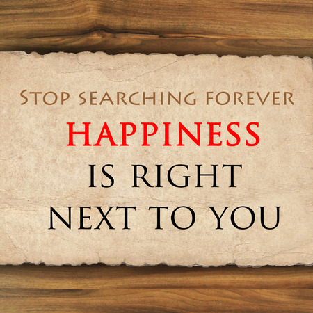 Inspirational quote on  grunge paper against wood backgroundの写真素材